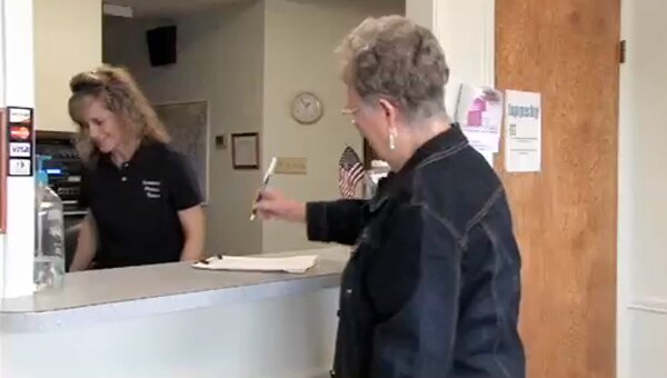 Chinese Bell ; A large bell inscribed with Chinese characters.